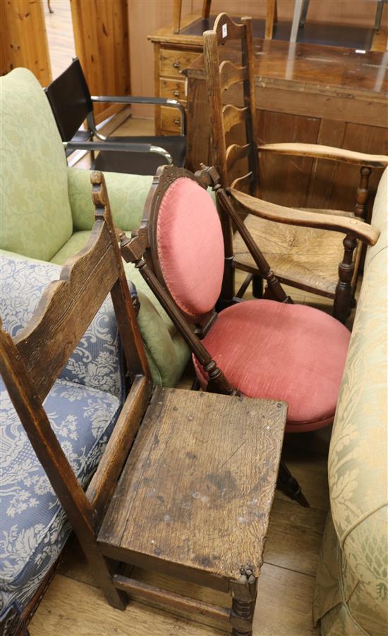 A County rush seat ladderback elbow chair, and two others
